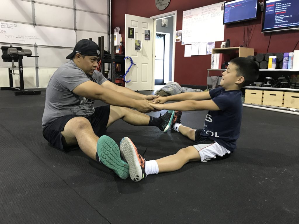 Dad and son stretching