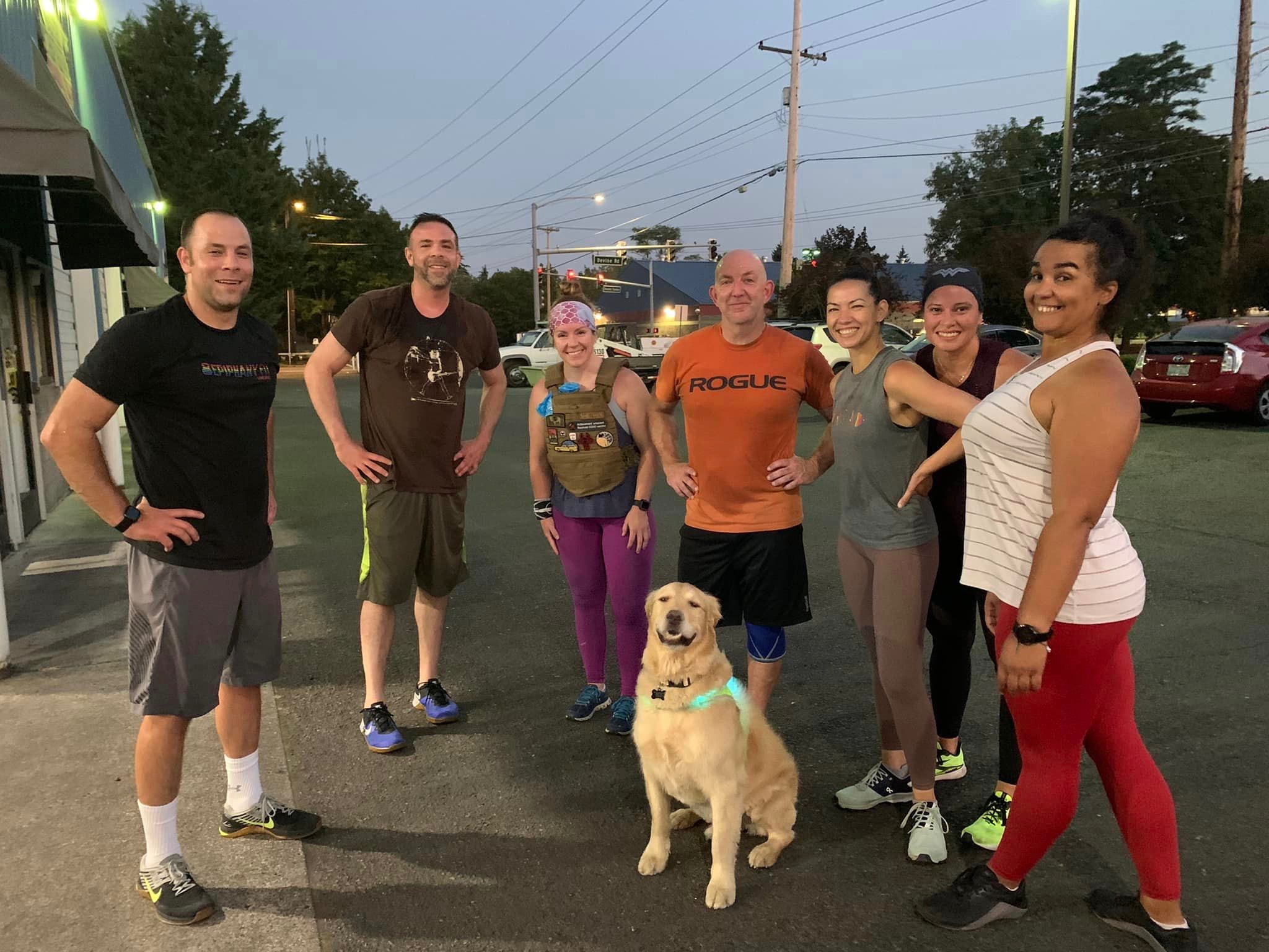 Group of happy Epiphany FIT members and a dog